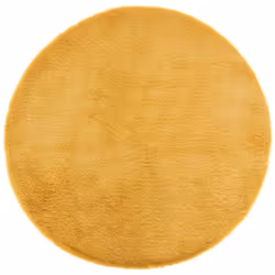 Tapis fausse fourrure extra doux OC 80 cm Très joli tapis rond en fausse fourrure extra doux couleur ocre de diamètre 80 cm.  ...