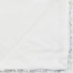 Plaid écru effet fourrure bouclée 120x160cm en polyester
