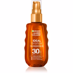 Enrichie en beurre de karité nourrissant, l’huile bronzante de soin avec indice de protection solaire SPF&nbsp;30 Garnier Amb ...