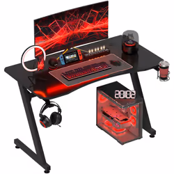 Transformez votre espace de jeu avec ce bureau gaming HOMCOM, conçu en panneau de particules pour une durabilité optimale. Do ...