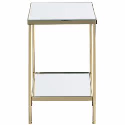 Table d'appoint fabriquée en tube d'acier laitonné avec cadre en acier plat laitonné et étagères en verre miroir. Ses pieds s ...