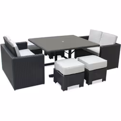 Ensemble repas de jardin encastrable en résine tressée noire et structure alu, composé d'une table avec plateau verre et empi ...