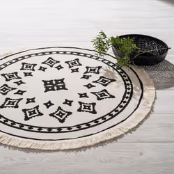 Le Tapis rond motif ethnique s'accorde parfaitement aux intérieurs contemporains. Optez pour son look moderne qui conviendra  ...
