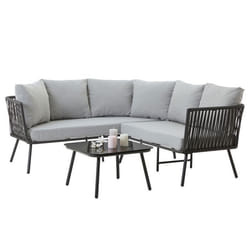 Salon de jardin JAKARTA avec 1 table basse en verre et 1 canapé dextérieur avec coussins gris résitants à leau