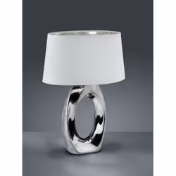 La lampe à poser TABA par Trio Lighting est composé d'une structure en céramique argentée et d'un abat-jour en tissu blanc av ...