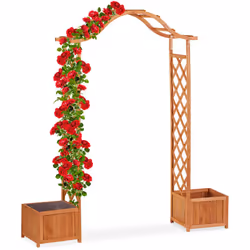 Cette arcade à rosiers en bois de sapin traité ne fournit pas seulement aux plantes grimpantes la prise nécessaire à son déve ...