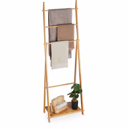 Grâce au porte-serviettes sur pied, vous pouvez faire sécher vos serviettes de bain en économisant de la place. Ce porte-vête ...