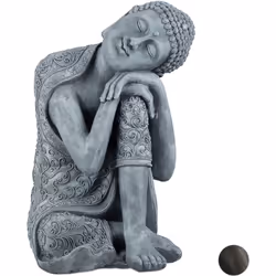 Cette statue représente un bouddha assis avec la tête penchée et appuyée sur sa jambe, un talisman pour le bonheur et le savo ...
