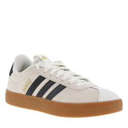 Tennis en cuir blanches et noires à semelle marron avec logo doré