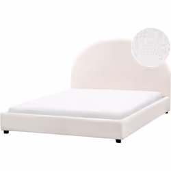 Lit minimaliste avec tête de lit demi-ronde. Les formes incurvées et les tissus à la texture riche définissent les meubles pa ...