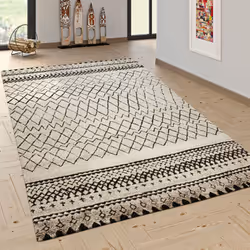 Ce tapis coloré à poils ras vous charmera par son aspect nomade. Les teintes variées sont ornées de nombreux symboles et moti ...
