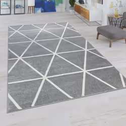 Des formes géométriques dures et un style convivial : Très tendance, ces tapis associent des motifs géométriques à des couleu ...