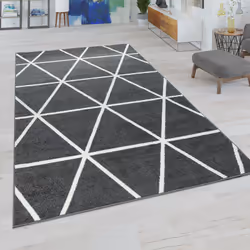 Des formes géométriques dures et un style convivial : Très tendance, ces tapis associent des motifs géométriques à des couleu ...