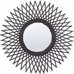 Miroir rond en rotin noir. Un miroir boho décoratif en forme de soleil est un accent parfait qui s'adapte bien à tout type de ...