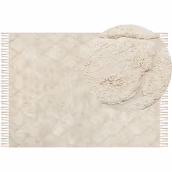 Tapis shaggy de style boho. Ce tapis beige aux doux détails texturés est idéal pour rendre une pièce encore plus chaleureuse. ...