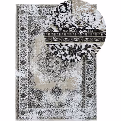 Tapis beige et gris au style vintage et motifs orientaux. Le tapis à poil court est un accessoire idéal pour les intérieurs c ...