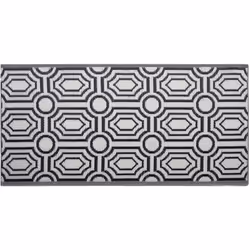 Tapis noir au style moderne. Ce tapis réversible est une décoration qui attire l'attention et convient aussi bien à l'intérie ...