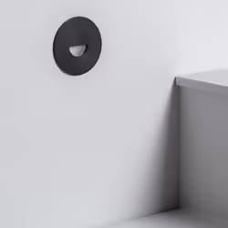 La Balise LED Extérieure 2W Encastrable au Mur Ronde Guell Noire est un élément d'éclairage complémentaire, qui émet une lumi ...