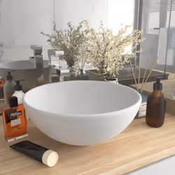 Ce lavabo rond, fait de céramique de première qualité, est un supplément élégant parfait à toute salle de bain, cabinet de to ...