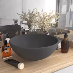 Ce lavabo rond, fait de céramique de première qualité, est un supplément élégant parfait à toute salle de bain, cabinet de to ...