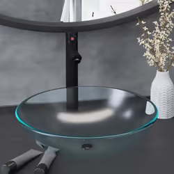 Ce lavabo de salle de bain à vasque circulaire avec robinet et drain à poussoir est conçu pour être placé sur le comptoir et ...