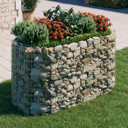 Ce lit surélevé en gabion est un moyen pratique de créer une bordure solide pour les fleurs dans votre jardin et sur votre te ...
