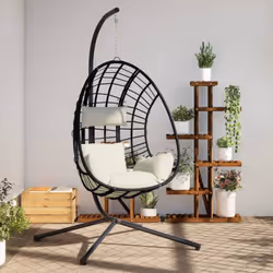 Asseyez-vous et profitez d'un moment de détente dans votre espace de vie avec cette fascinante chaise suspendue en forme d'œu ...